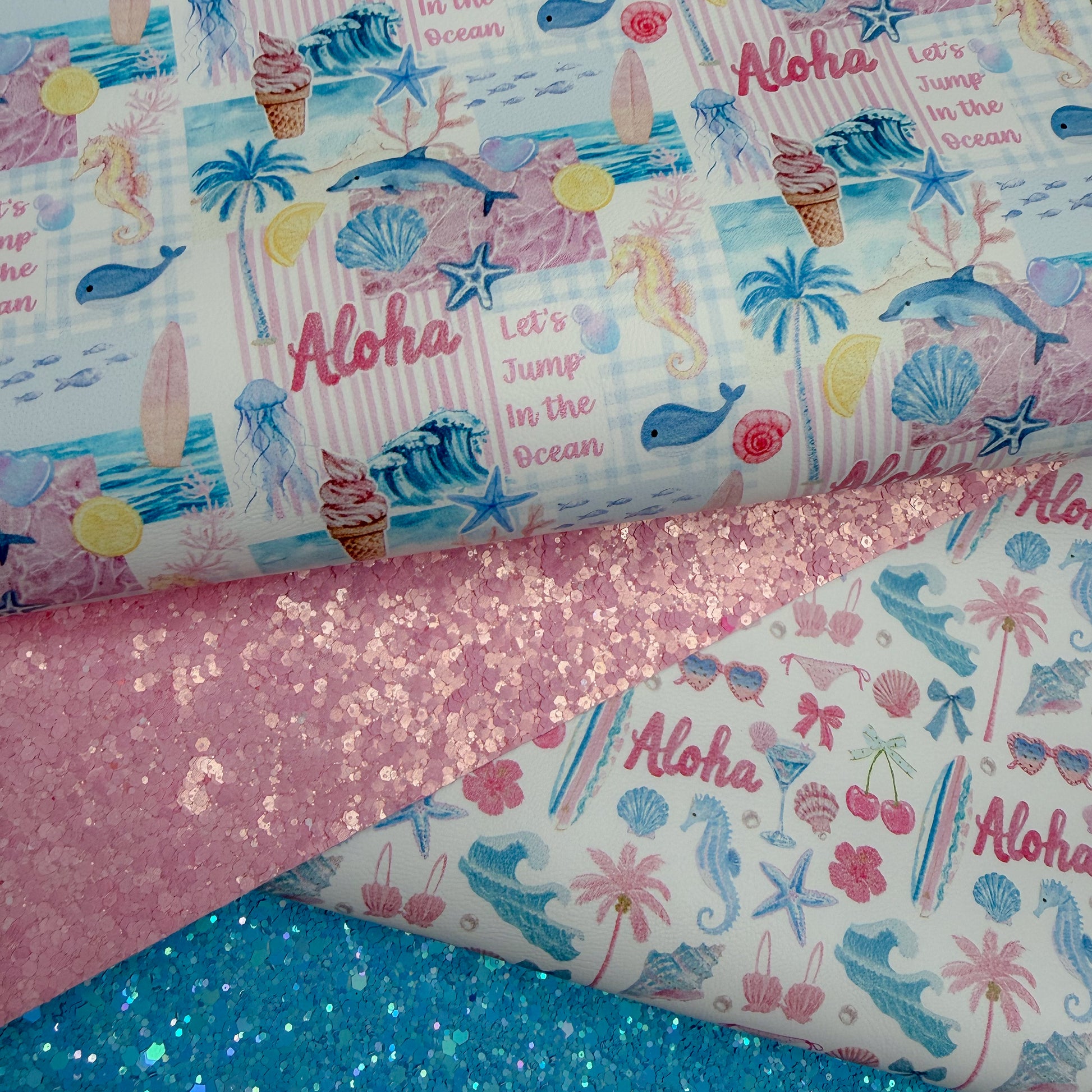 Beach glitter colour fabric with ocean-themed patterns and 'Aloha' faux leather 